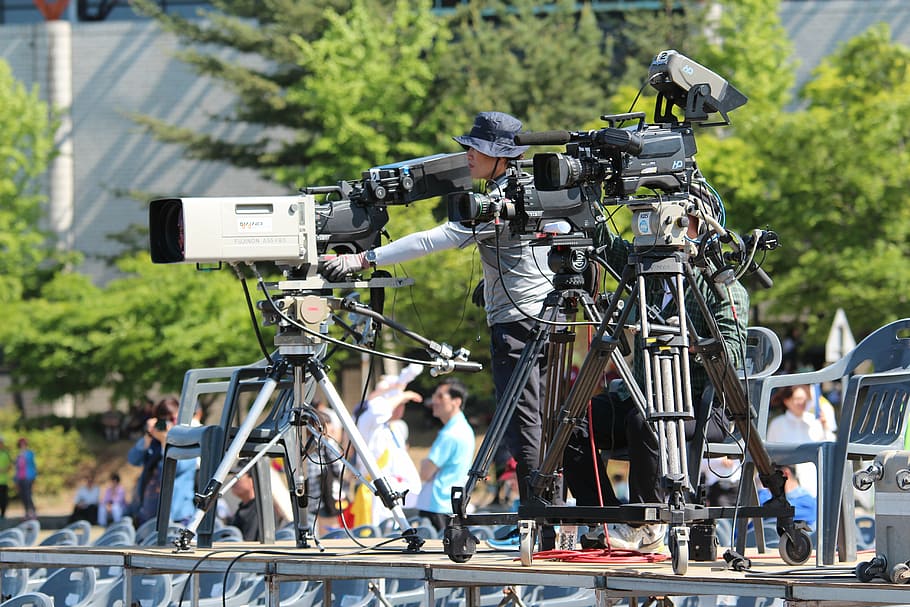 two woman using camera with stand, video, video camera, broadcasting HD wallpaper