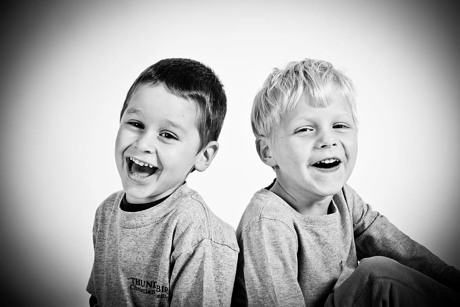 two boys smiling grayscale photography, happy, kids, small, children