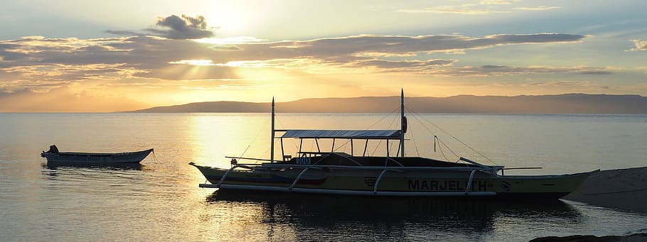 sunset, boat, outrigger, suns rays, golden, sky, reflections HD wallpaper