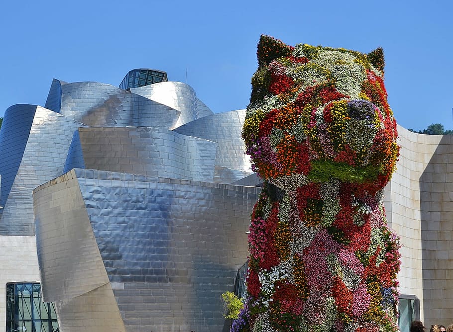 multicolored floral dog topiary at daytime, bilbao, pupi, guggemheim