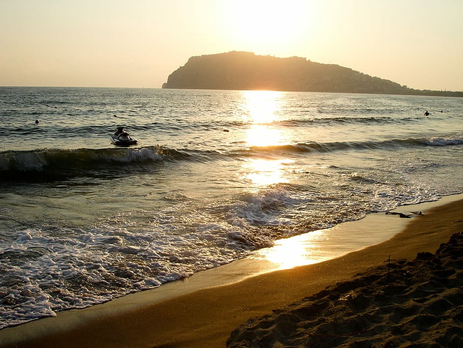 Sunset, Beach, Light, Sea, Jetski, cliff, water, wave, sunlight HD wallpaper