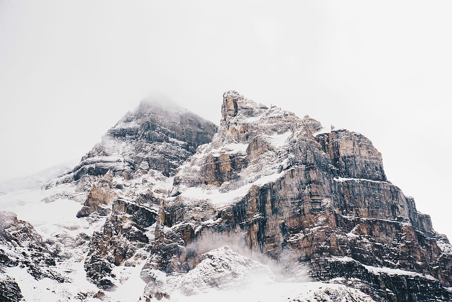 aerial photo of ice-covered mountain, brown and black mountain HD wallpaper