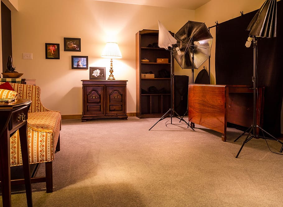 brown wooden console table near white wall, studio, bonus room