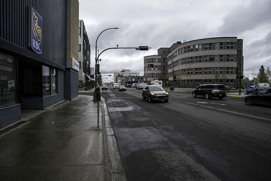 Streets of downtown Yellowknife, buildings, cars, clouds, lights HD wallpaper