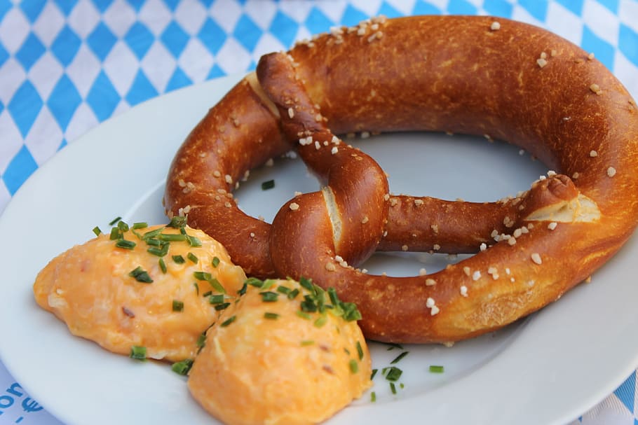 flat lay photography of baked breads with plate, Pretzel, Bavaria