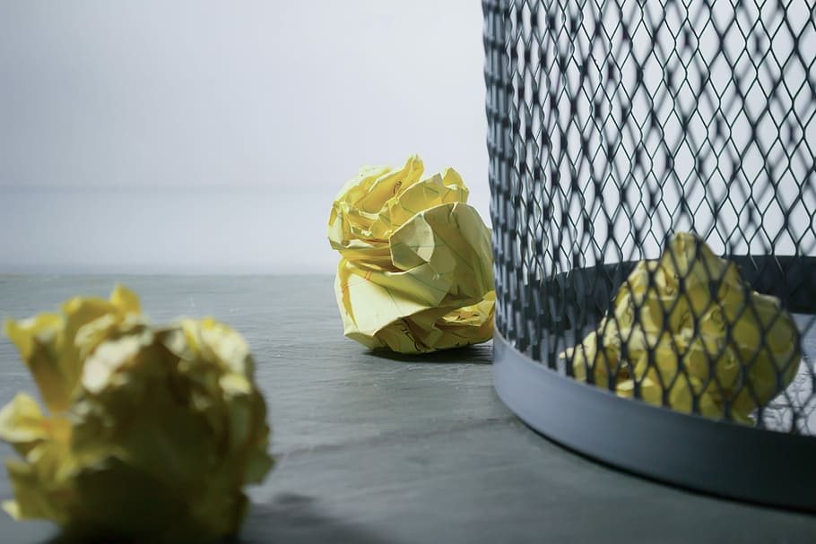 yellow crumpled papers, three yellow printer papers, trash can HD wallpaper