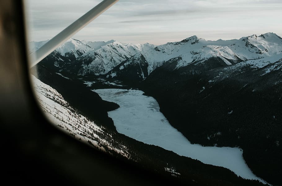 black and white mountains, aerial photography of body of water between mountain HD wallpaper