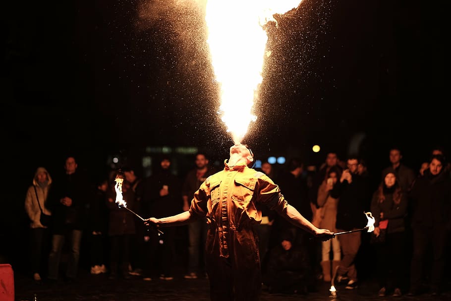 man spitting fire photography, performing, front, crowd, people HD wallpaper