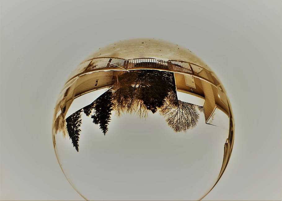 shark eye sepia tone photography of gate in front of trees, crystal ball reflecting trees during daytime HD wallpaper