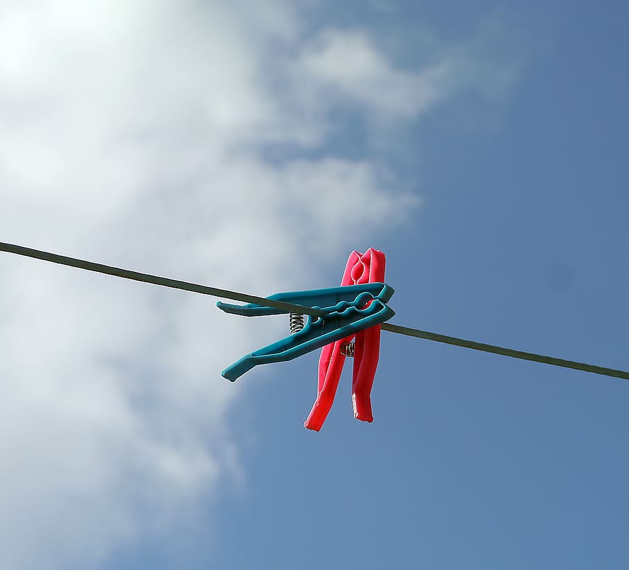 two blue and red clothespin on black cable, clothesline, laundry