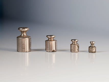 four gray metal tools on white surface, weights, libra, old HD wallpaper