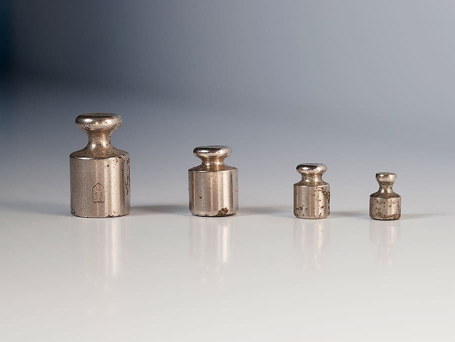 four gray metal tools on white surface, weights, libra, old HD wallpaper