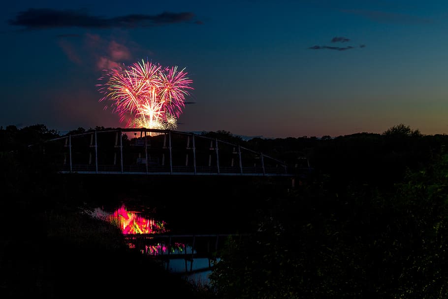 silhouette photo of suspension bridge in front of fireworks, fireworks display at nighttime HD wallpaper