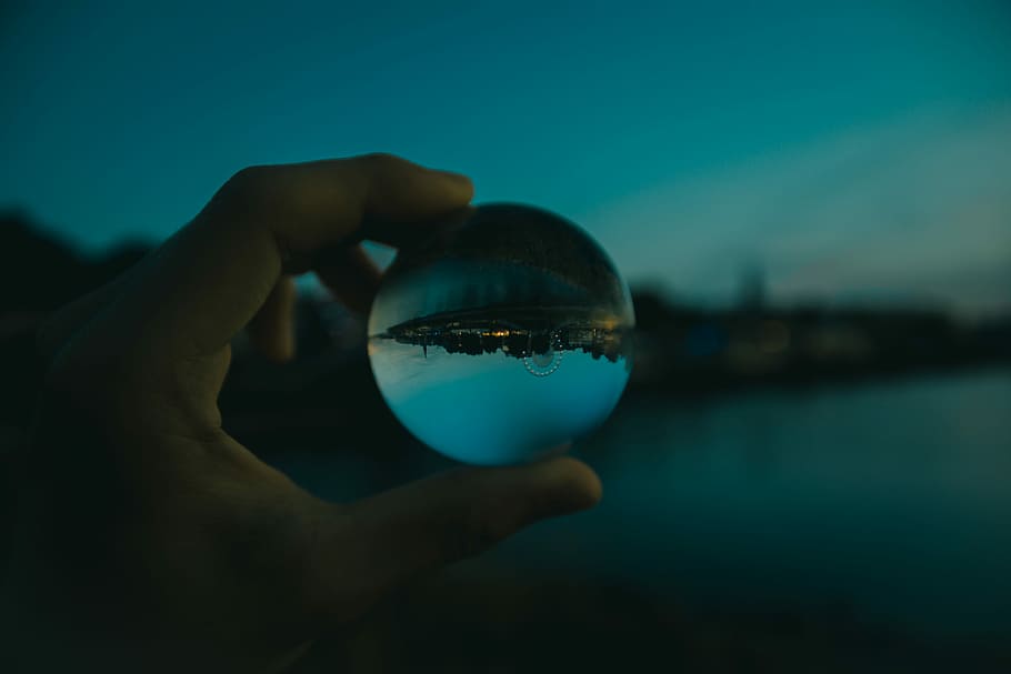 person holding clear glass ball, focu, hand, lake, bokeh, festival HD wallpaper