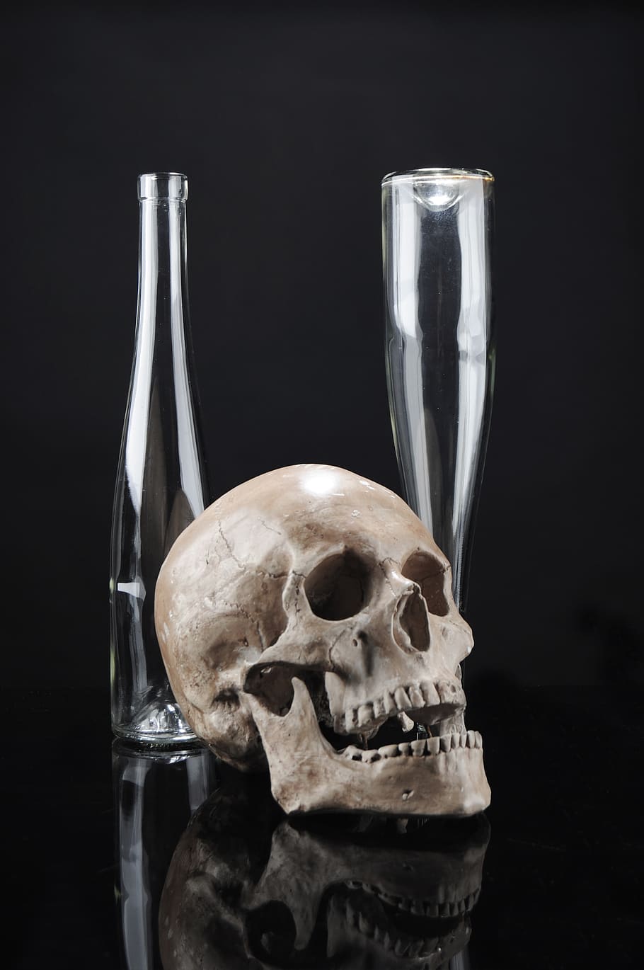 beige skull beside glass bottles, skeleton, contrast, composition HD wallpaper