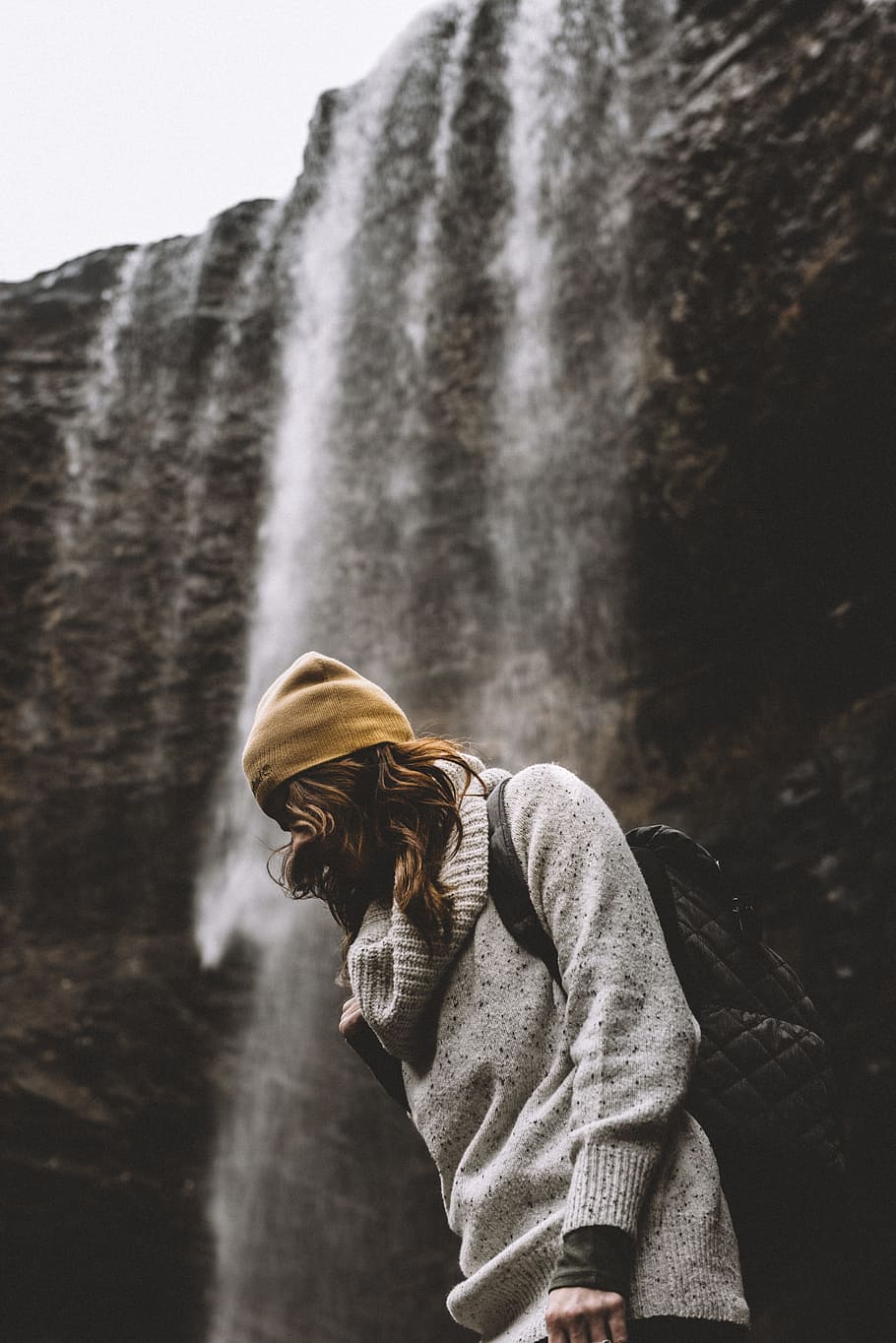 woman in knit cap standing near waterfalls, woman standing near waterfalls, HD wallpaper