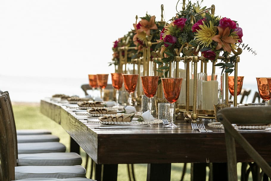 orange tinted wine glasses on rectangular brown wooden dining table, plates and cups on table HD wallpaper