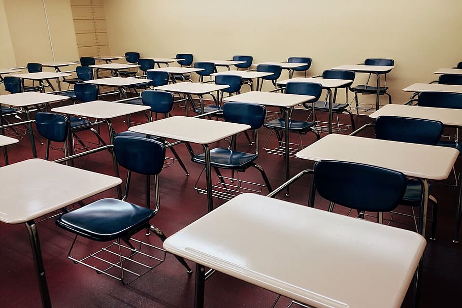 white school desk with stainless steel base and blue padded armchairs HD wallpaper