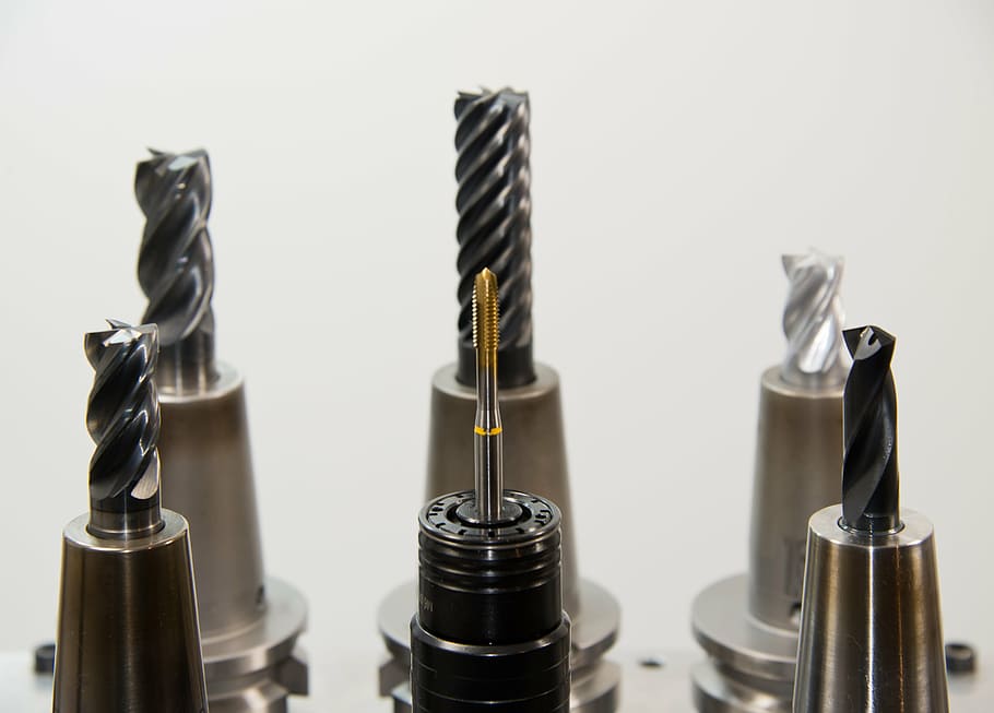 six drill bits on white surface, taps, thread, milling, milling machine