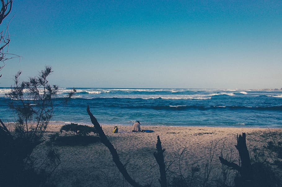 seascape photography of seashore, person sitting on seashore HD wallpaper