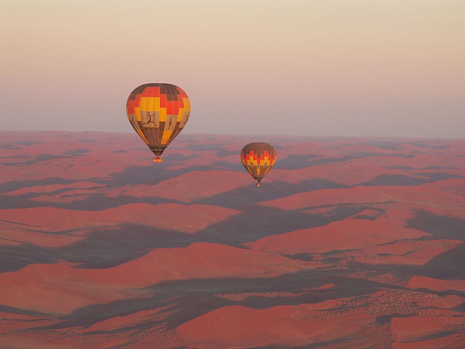 two hot air balloons floating in the sky above desert, travel, HD wallpaper
