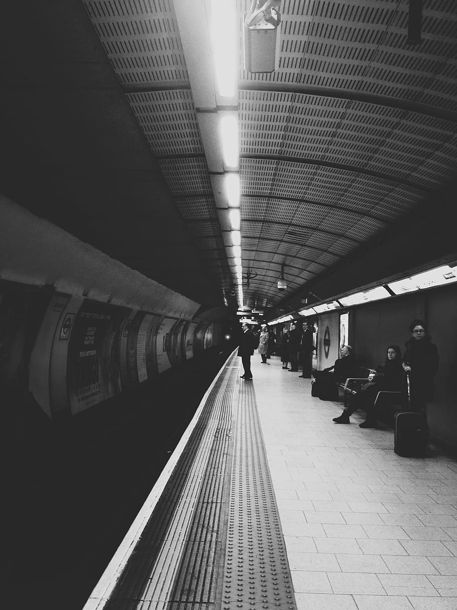 grayscale photograph of person standing on train station, underground HD wallpaper