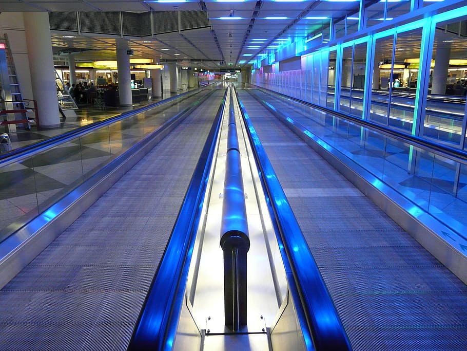 gray travelator with blue LED lights, moving walkway, roller platform