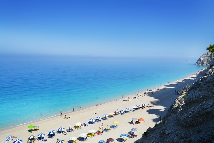 beach, sea, blue, vacation, holiday, water, sky, land, group of people HD wallpaper