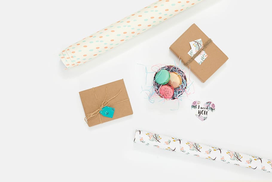 flat lay photography of wallpaper and box, macaroons in between two brown boxes HD wallpaper