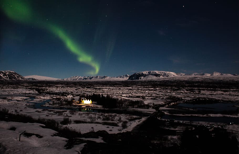 aurora borealis appeared on sky, aurora on sky during night time above trees and mountains HD wallpaper