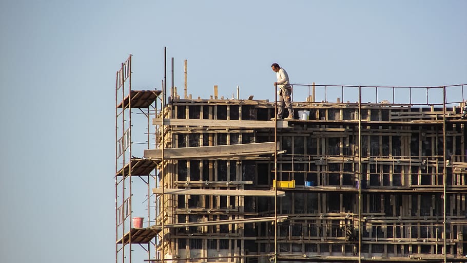 man standing on scaffolding, construction, dangerous, construction worker HD wallpaper