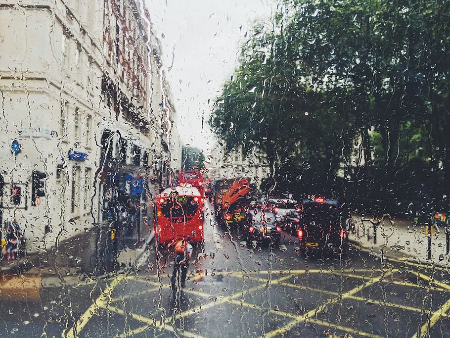 photo of red bus on street from window, man near red bus during daytime HD wallpaper