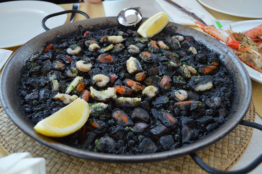 cooked food on wok near plates, paella, spain, dish, mallorca