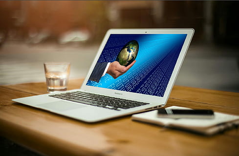 turned-on white laptop computer on brown wooden surface, forward HD wallpaper