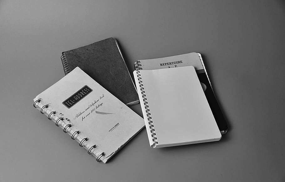 White Notebook on White and Black Book, address book, black-and-white, HD wallpaper