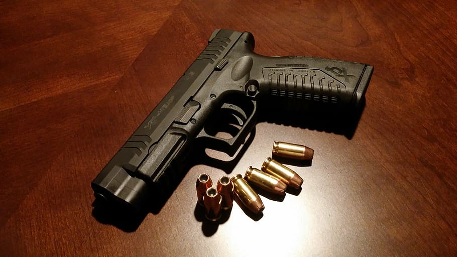 black pistol with bullets on brown surface, handgun, firearms