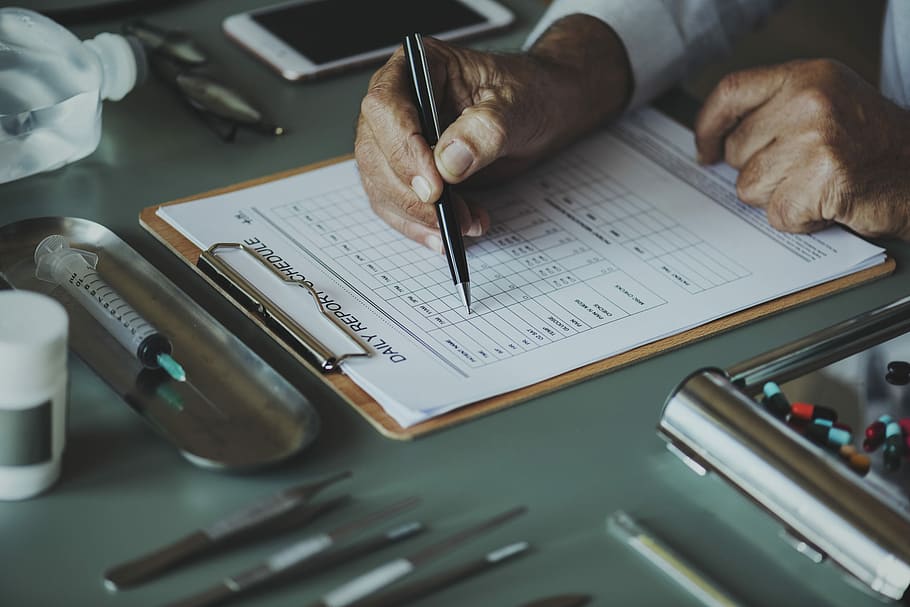 person holding ballpen while writing on paper, abstract, working HD wallpaper
