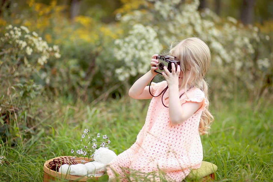 girl sitting on grass field holding black camera, nature, plants, HD wallpaper