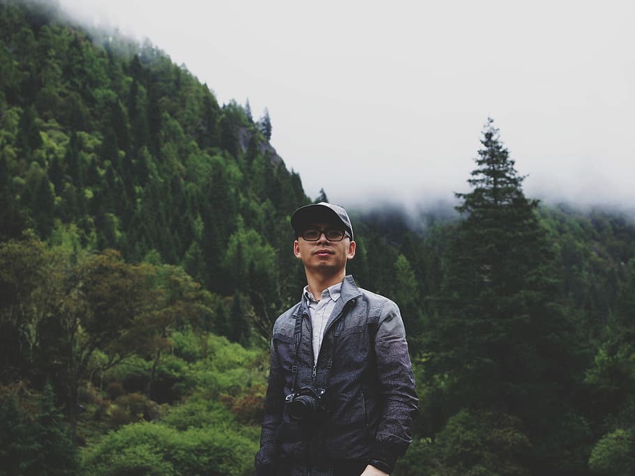 man standing near trees, man standing near trees on hill, male HD wallpaper