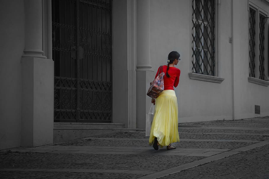 selective color of woman in red long-sleeved top and yellow skirt walking on near building, HD wallpaper