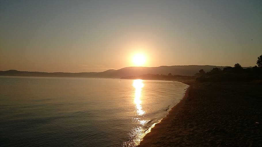 east, sun, west, beach, sky, water, sunset, beauty in nature HD wallpaper