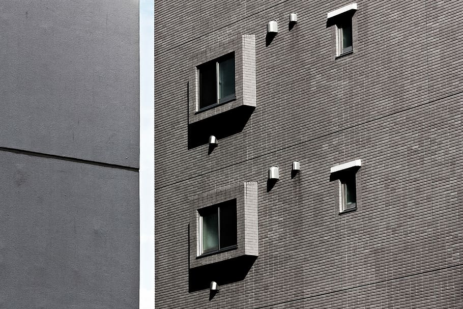 architectural photography of gray building, glass windows of building HD wallpaper