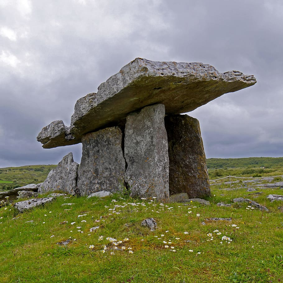 gray rock formation surrounded with grass, ireland, burren, dolmen