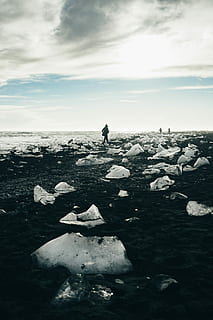 person walking beside body of water during daytime, untitled HD wallpaper