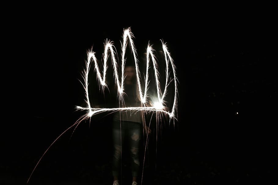 person holding fireworks, timelapse photo of white light, sparkler HD wallpaper
