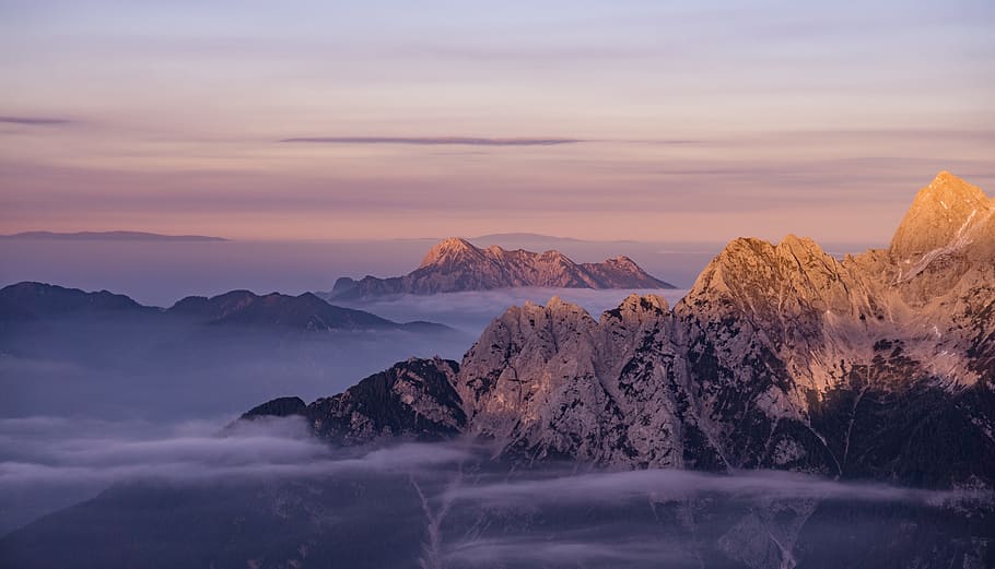 aerial photo of brown mountain surrounded by clouds, mountains HD wallpaper