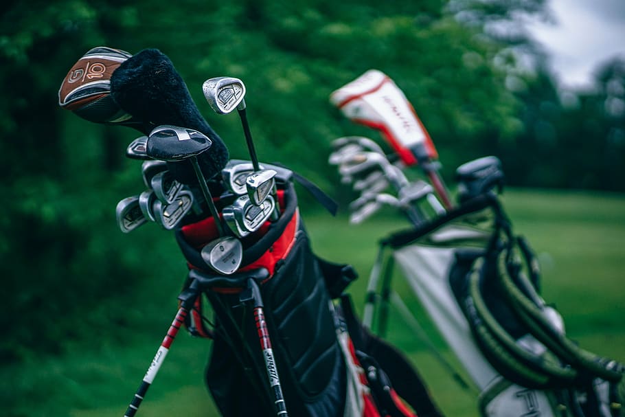 golf clubs in golf bags on grass field, green, outdoor, nature