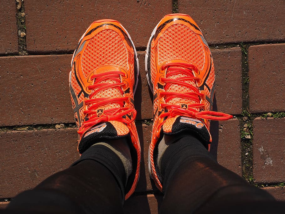 closeup photo of person wearing orange-and-black running shoes, HD wallpaper