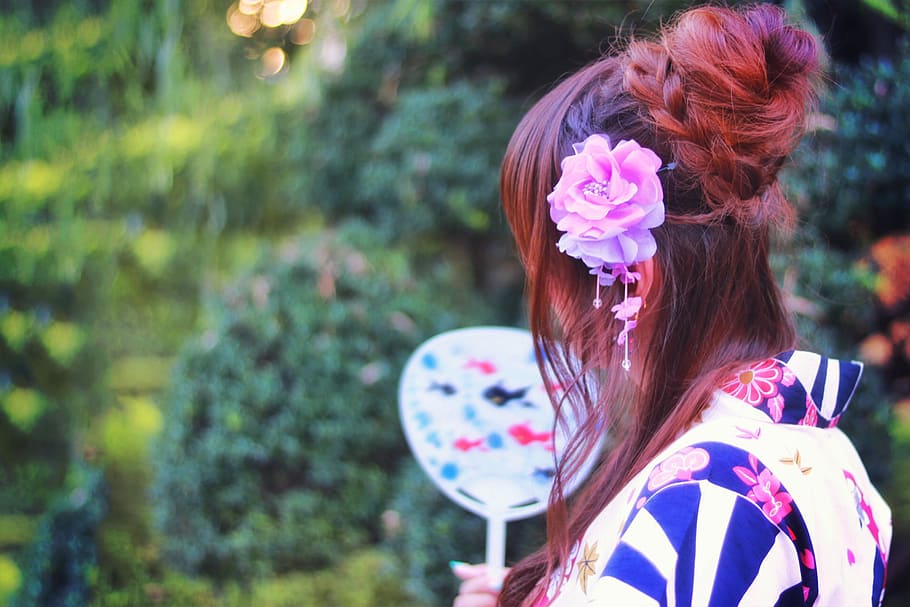 selective photo of brown and pink haired woman in black,white and blue floral dress HD wallpaper