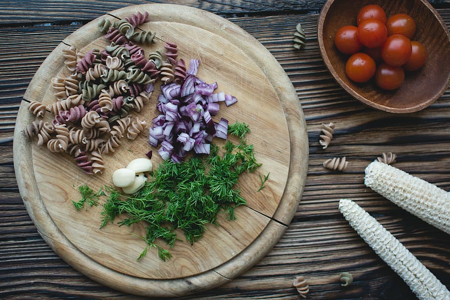 Pasta fusilli prepared for cooking, cherry tomatoes, close up HD wallpaper